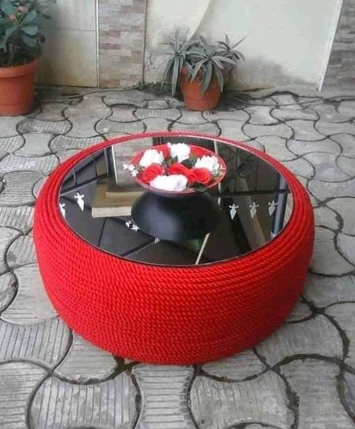 Nigerian Female artist Alice Obodom turns used car tyres into stylish things - See Beautiful Photos 5